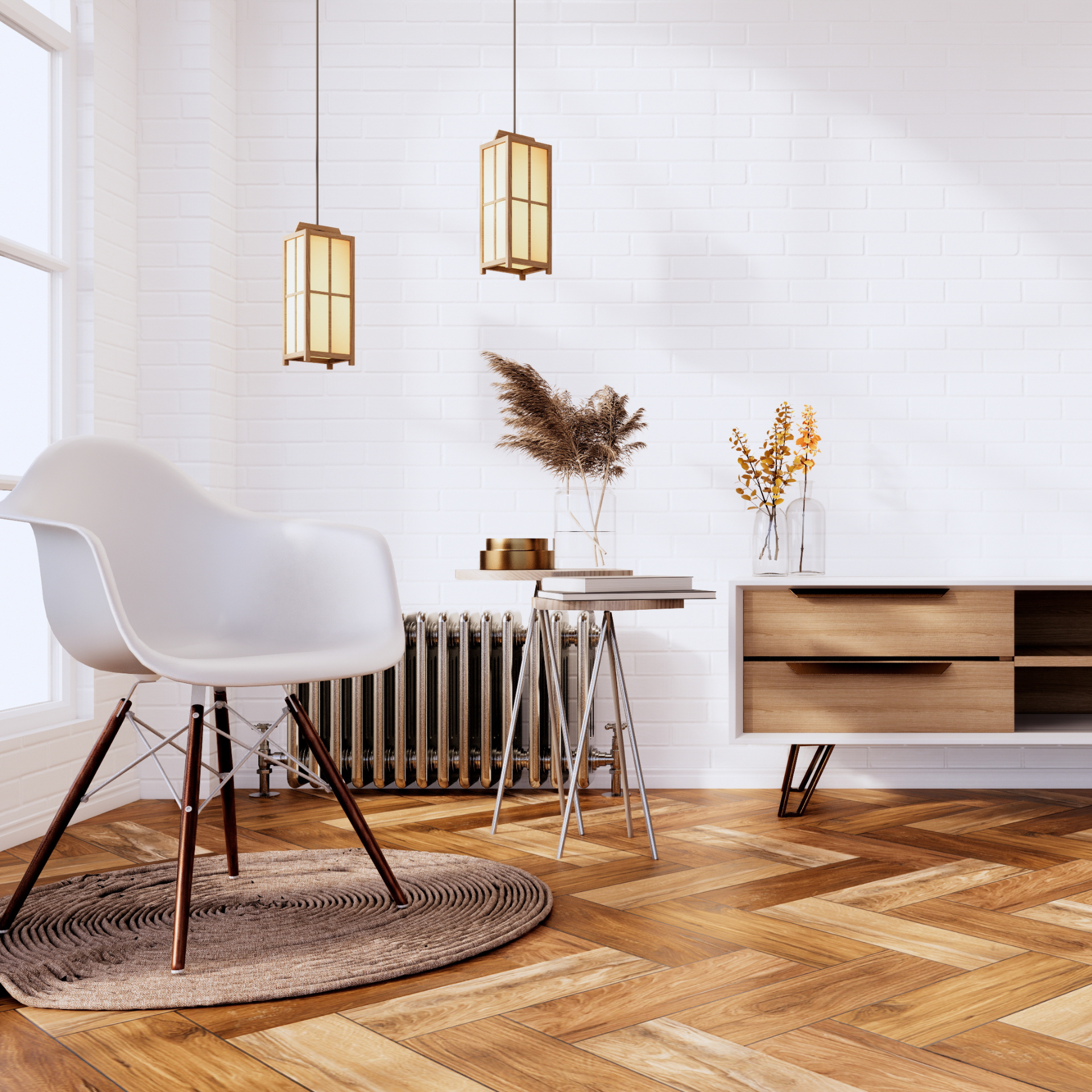 Modern minimalist living room with white chair, round rug, pendant lights, and wooden console on herringbone floor