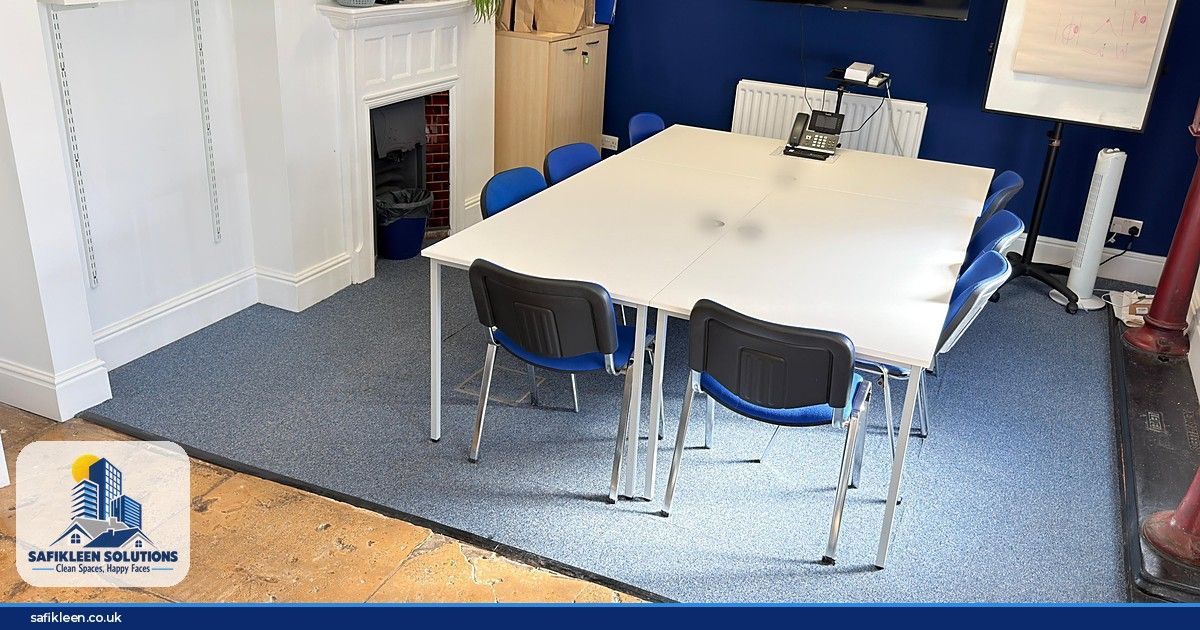Clean office meeting room with white tables and blue chairs after office cleaning in Peterborough