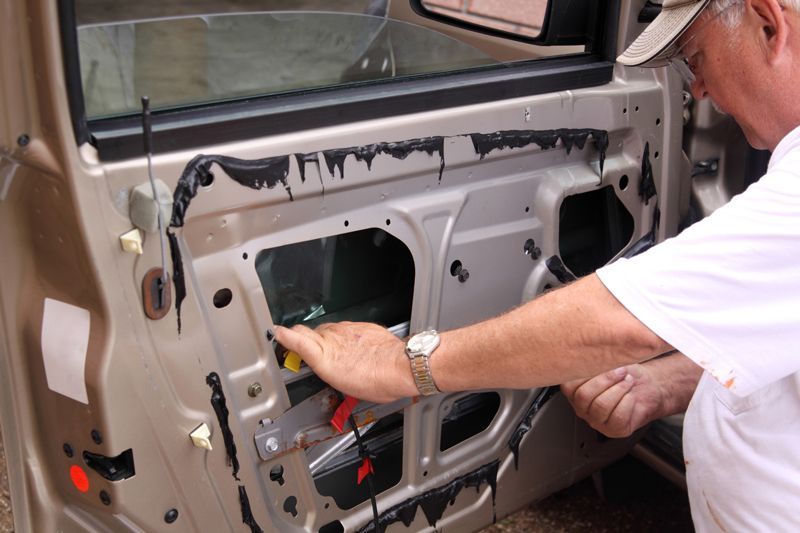 Route 66 Auto Glass Worker Fixing The Car Door Window In Bridgeview IL Route 66 Auto Glass Worker Fixing The Car Door Window In Bridgeview IL