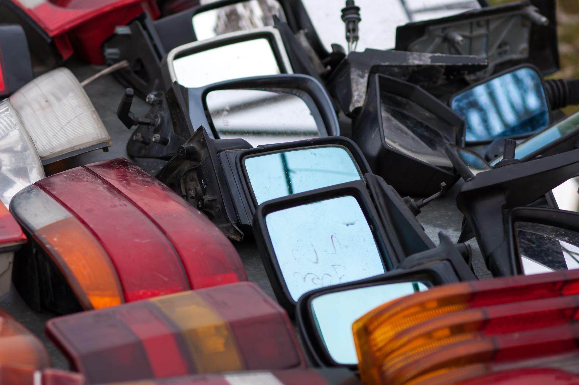 Old, used car parts on sale at the market.