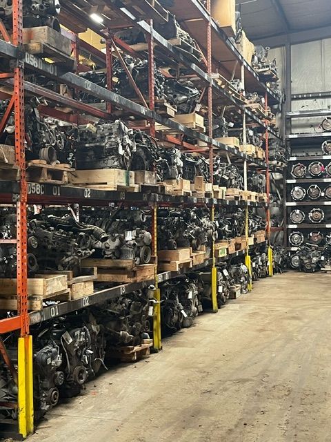 A large warehouse filled with lots of parts on shelves