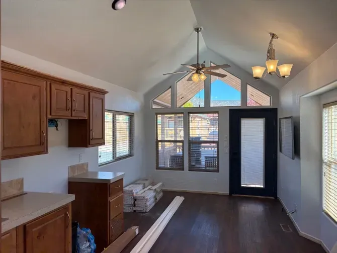 A large house with a lot of windows and a garage on a rainy day.
