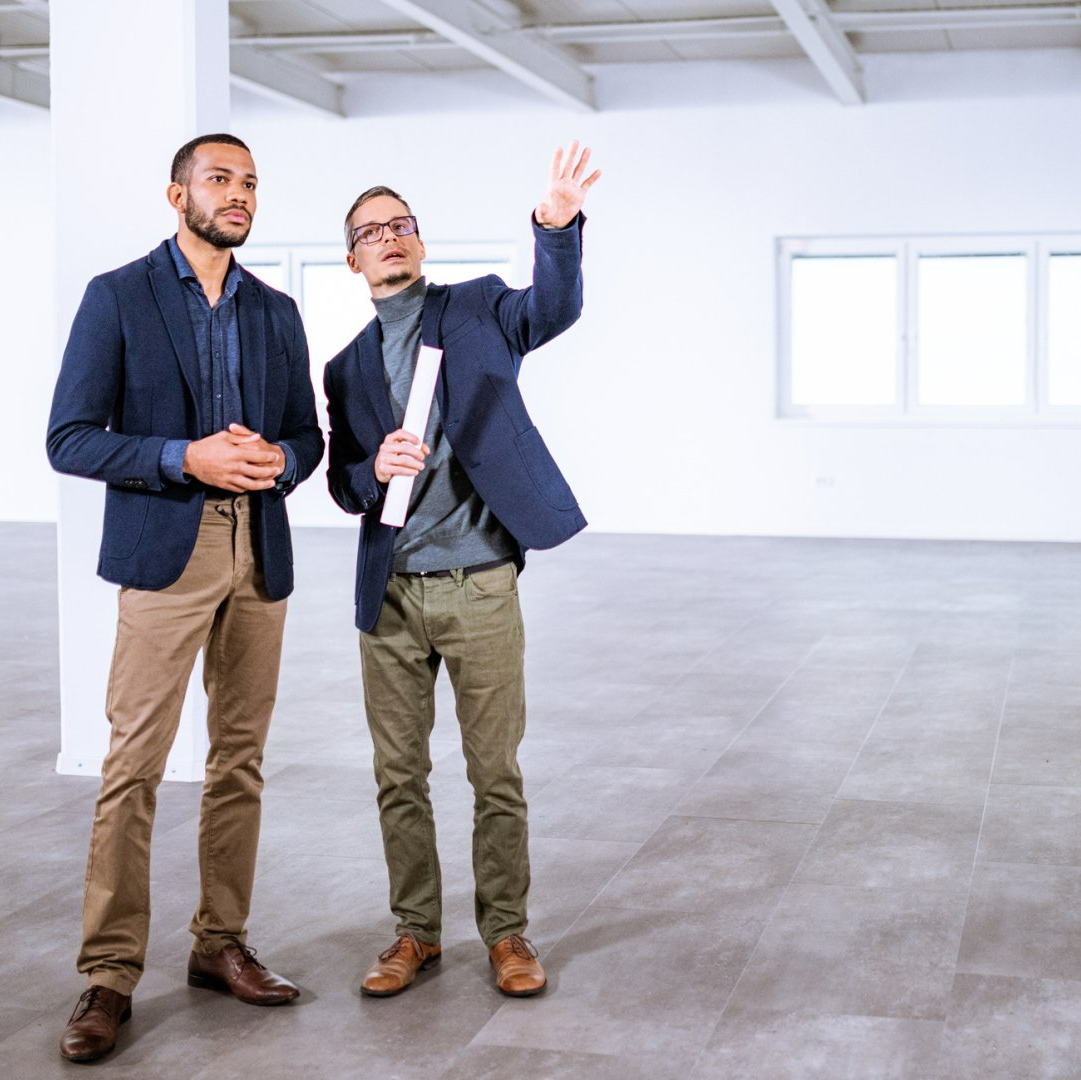Realtor discussing an empty house to the client