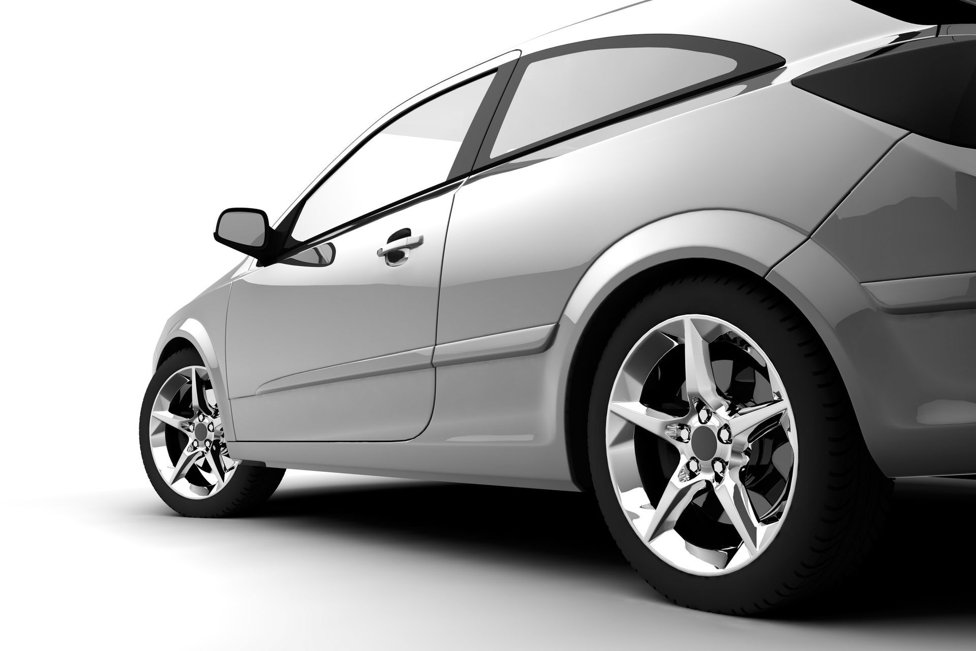 Silver car, side view, on white background; chrome wheels.