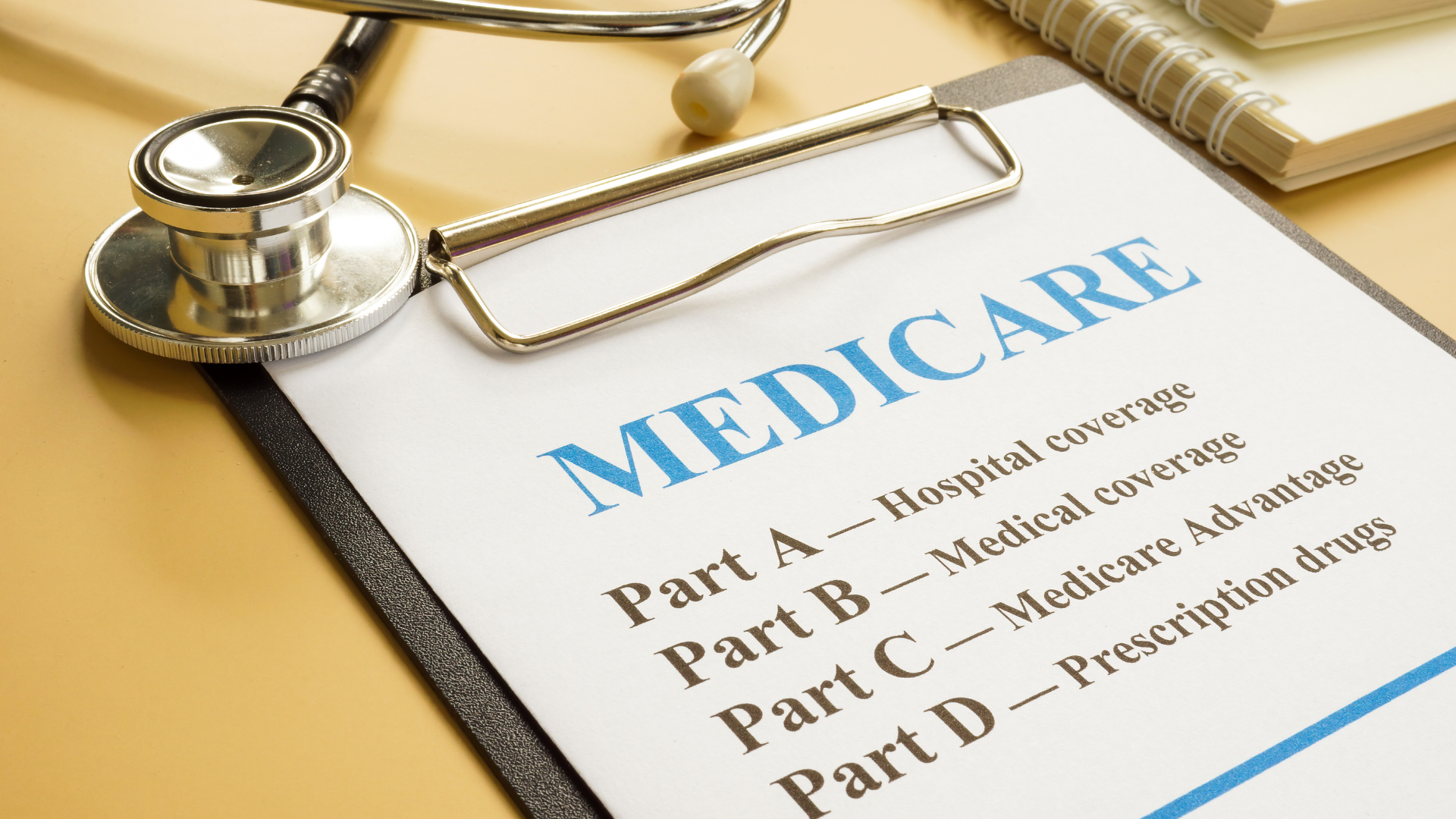 A stethoscope lies on a clipboard titled