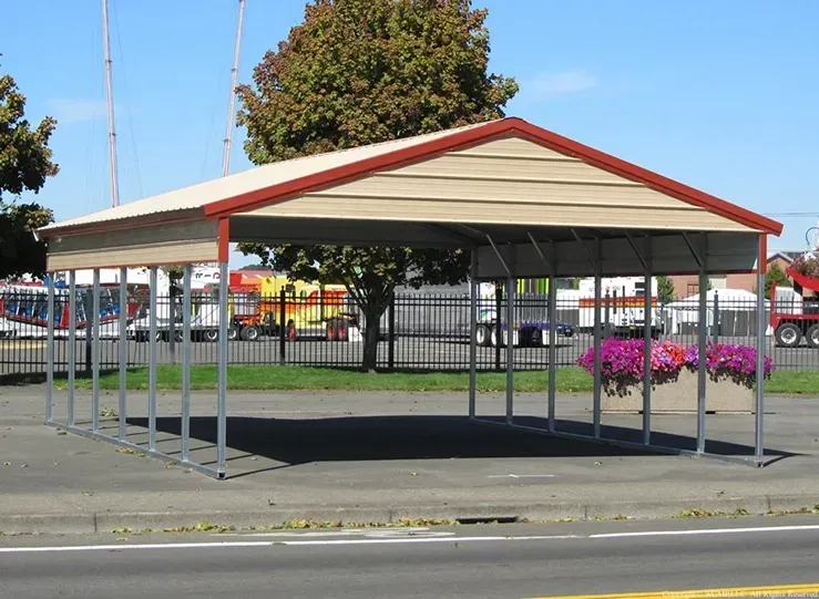 A carport with a red roof is on the side of the road