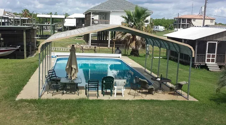 a large swimming pool with a canopy over it