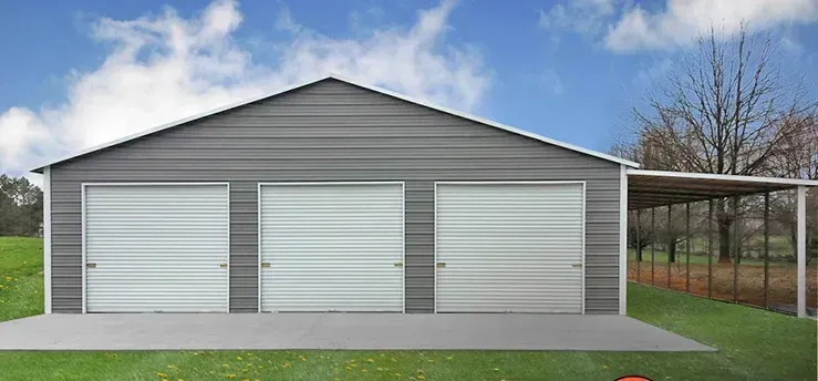 A metal garage with a carport attached to it.