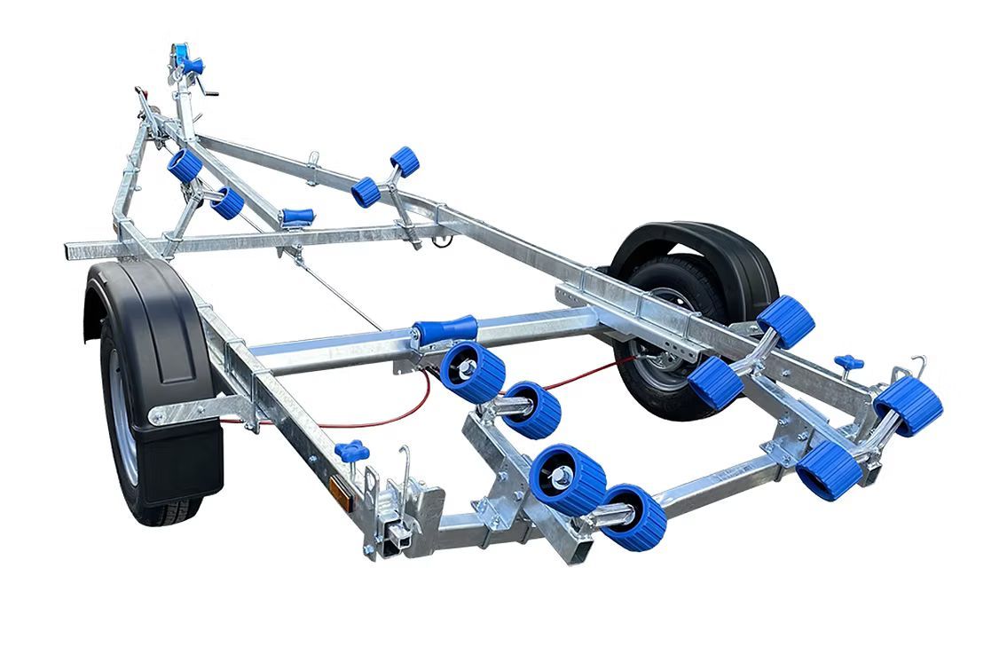 Boat trailer with blue rollers and black tires.