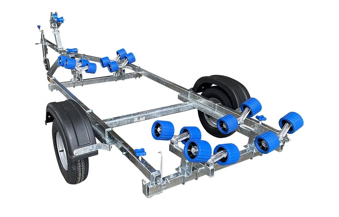 Boat trailer with red rollers and black tires.