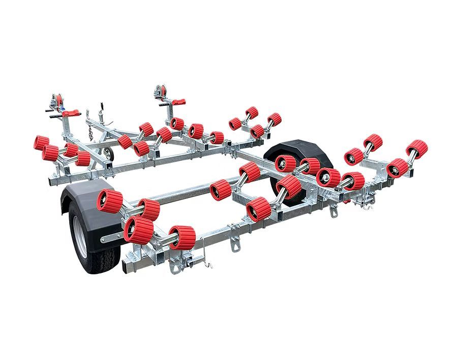 Boat trailer with numerous red rollers and a black tire.