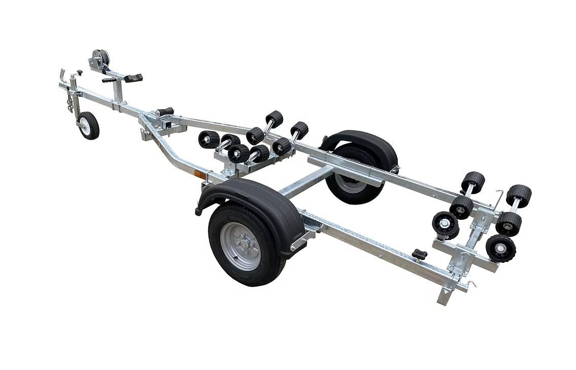 Boat trailer with blue rollers and two wheels.