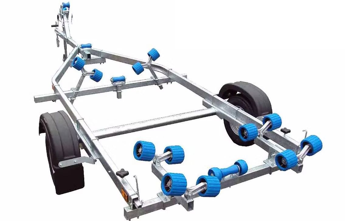 Boat trailer with blue rollers, gray frame, and black wheels.