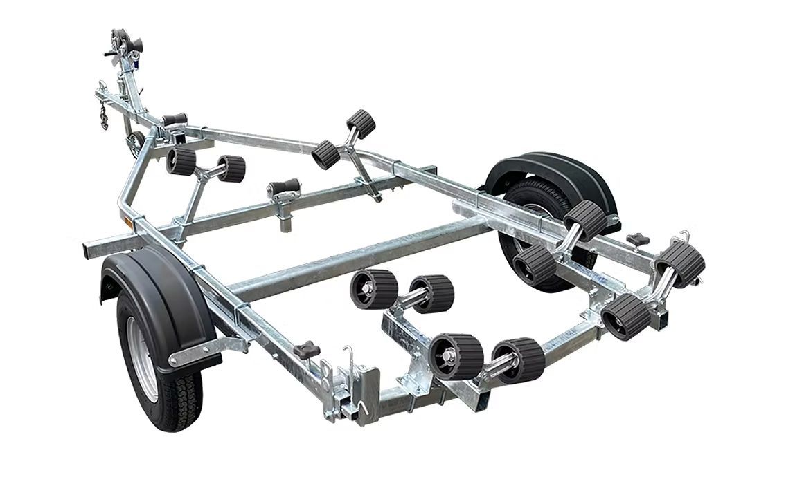Boat trailer with blue rollers, gray metal frame, black fenders, and wheels.