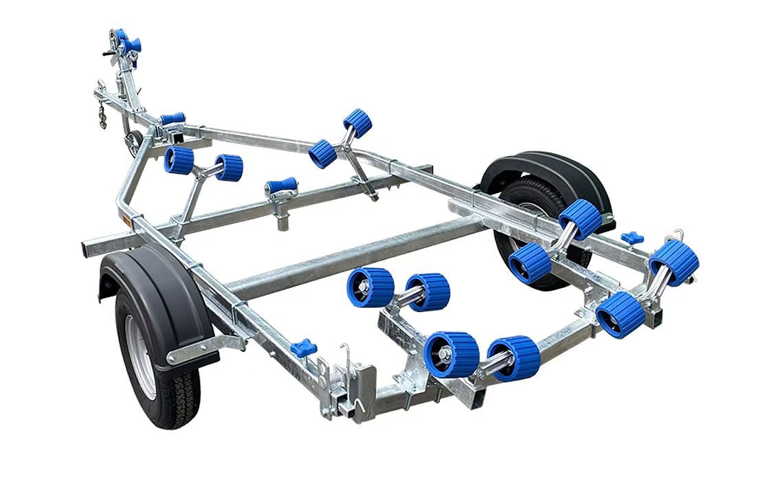 Boat trailer with blue rollers, gray metal frame, black fenders, and wheels.