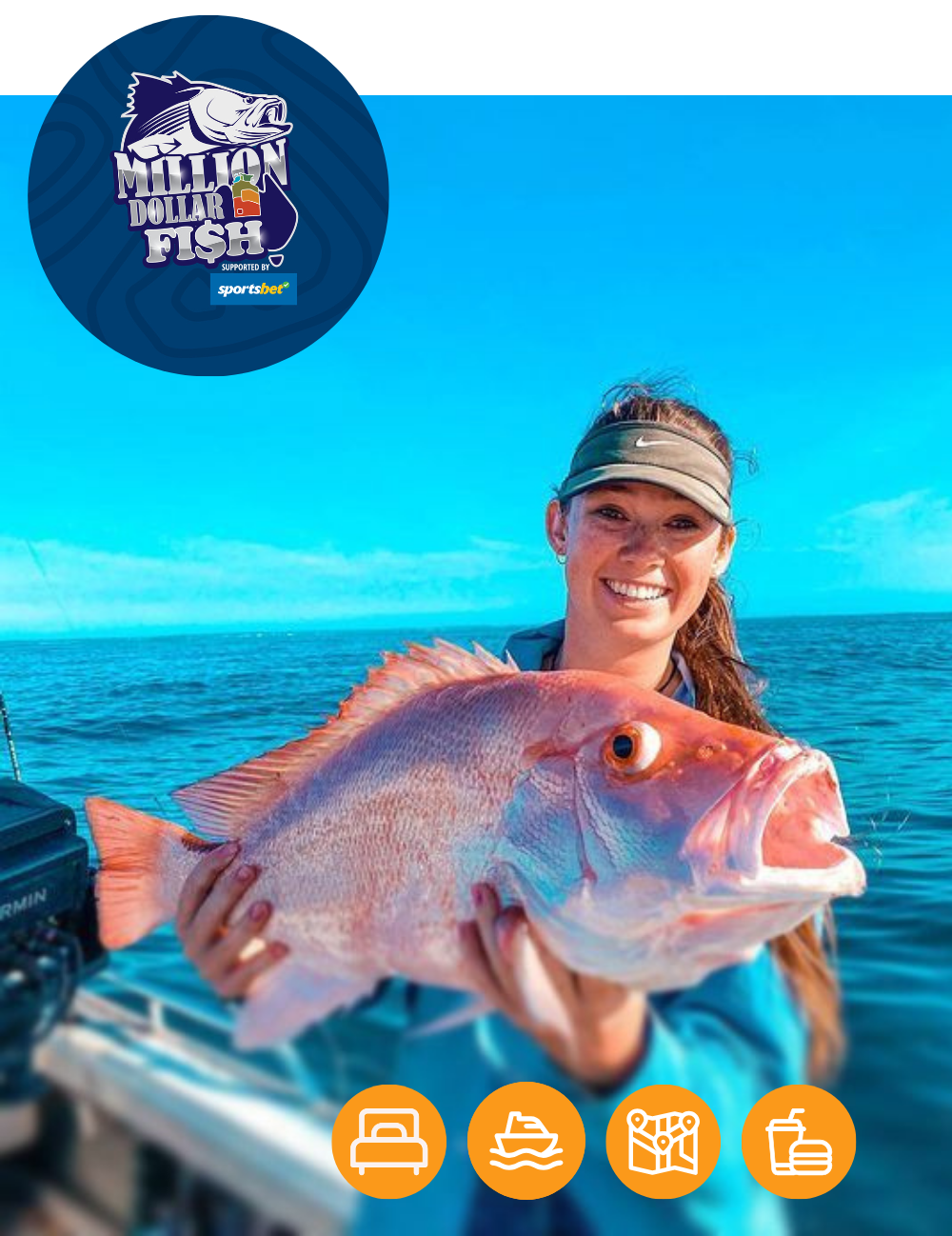 A woman is holding a large fish in her hands in the ocean.