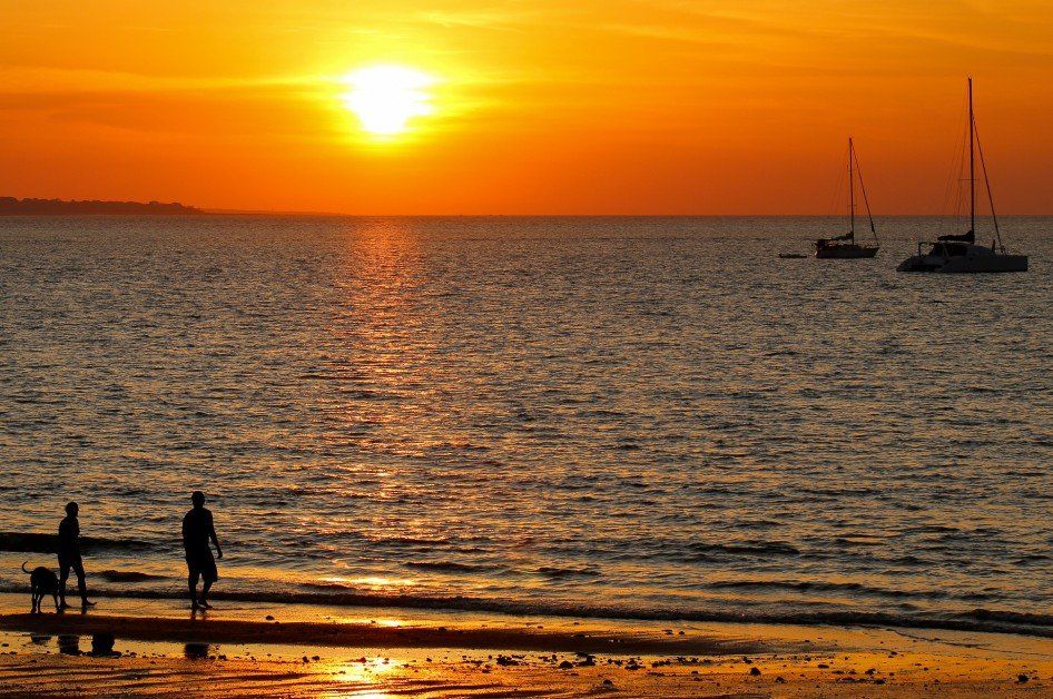 A man and a woman are riding a jet ski in the water.
