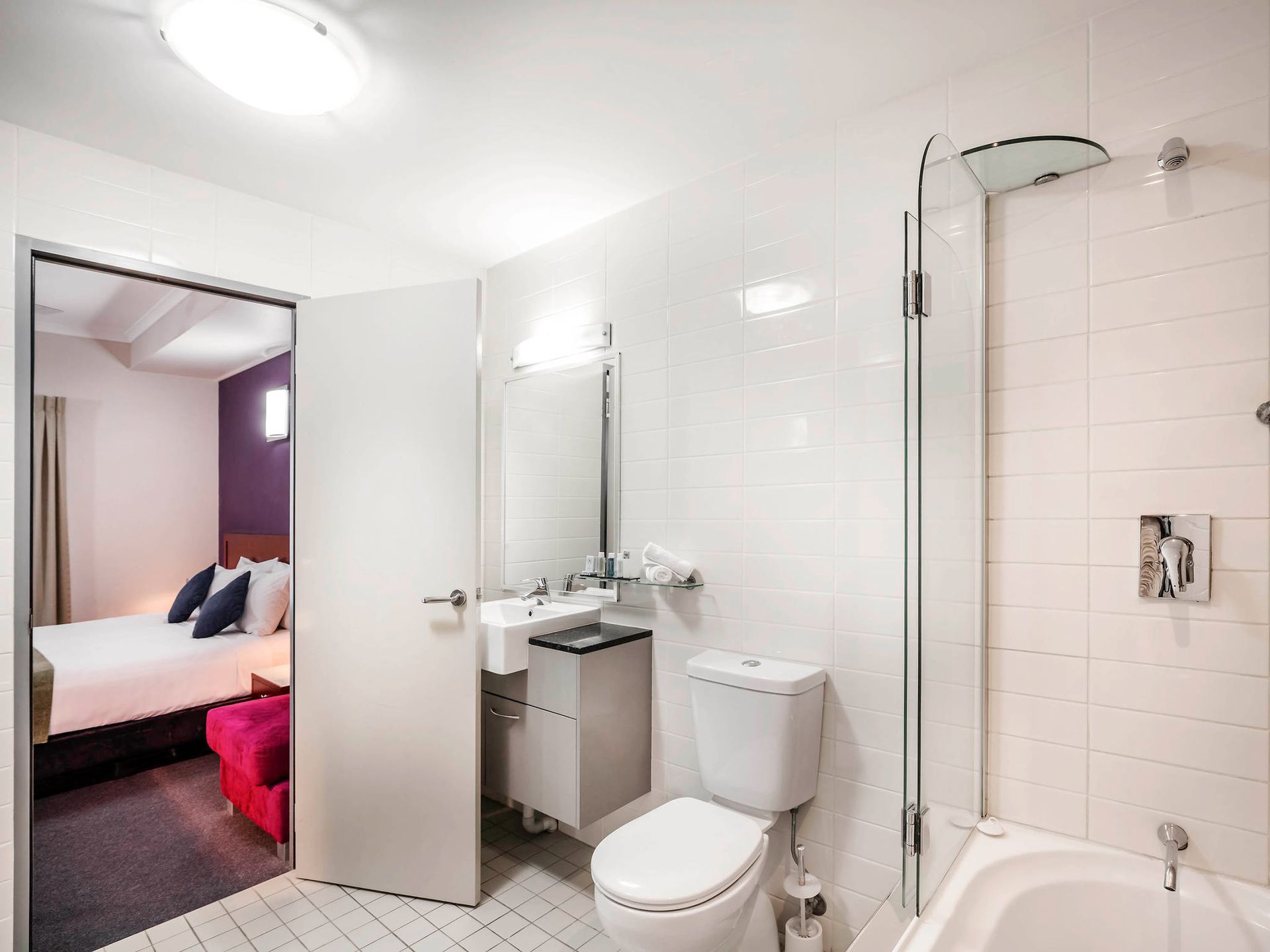A bathroom with a toilet a sink and a bathtub