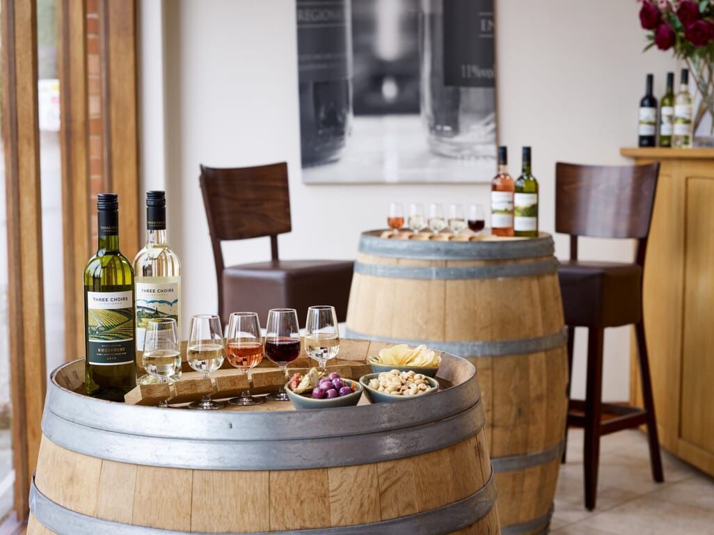 a wooden barrel with a bottle of wine on it