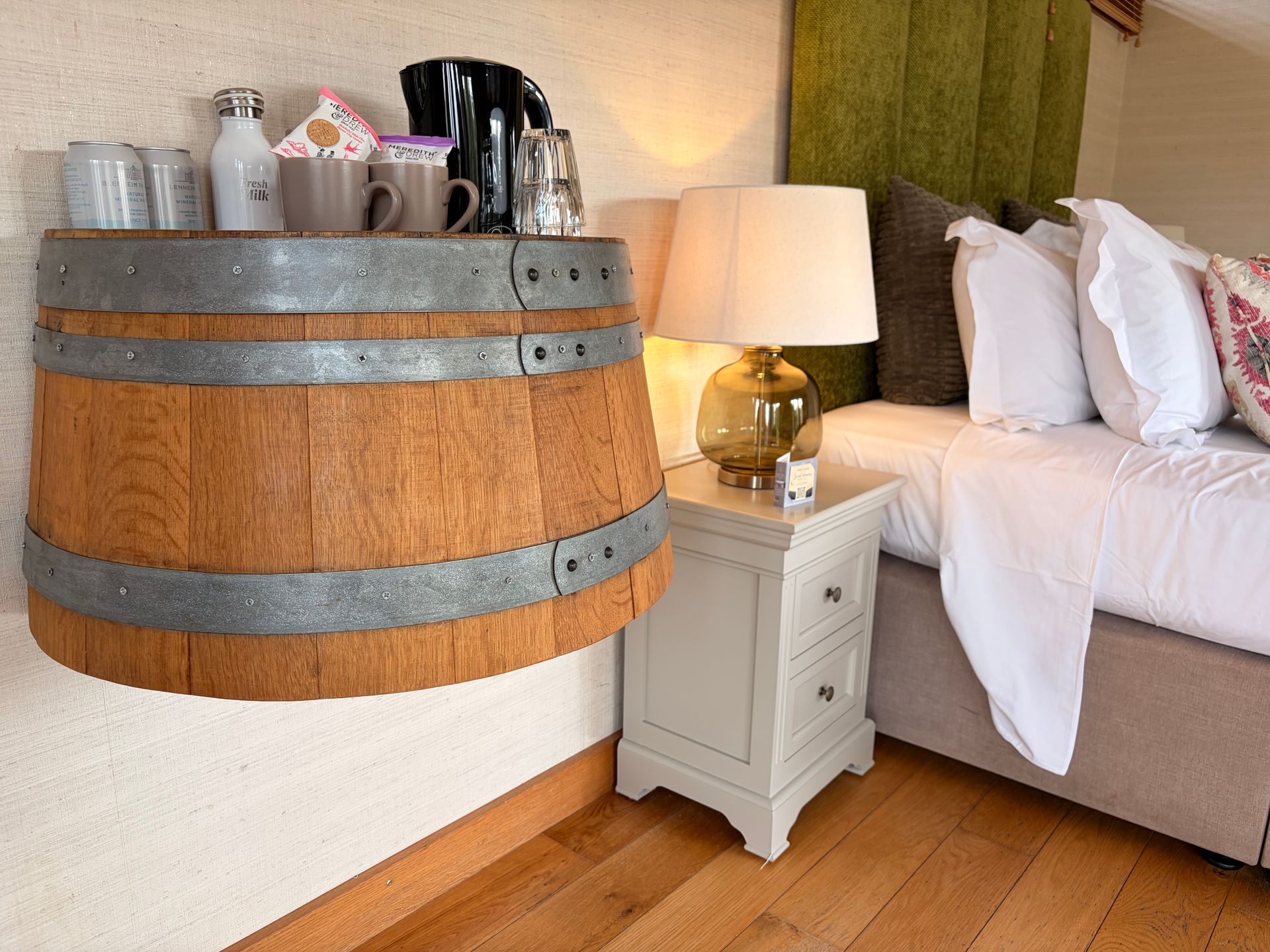 a bedroom with a bed a chair and a table