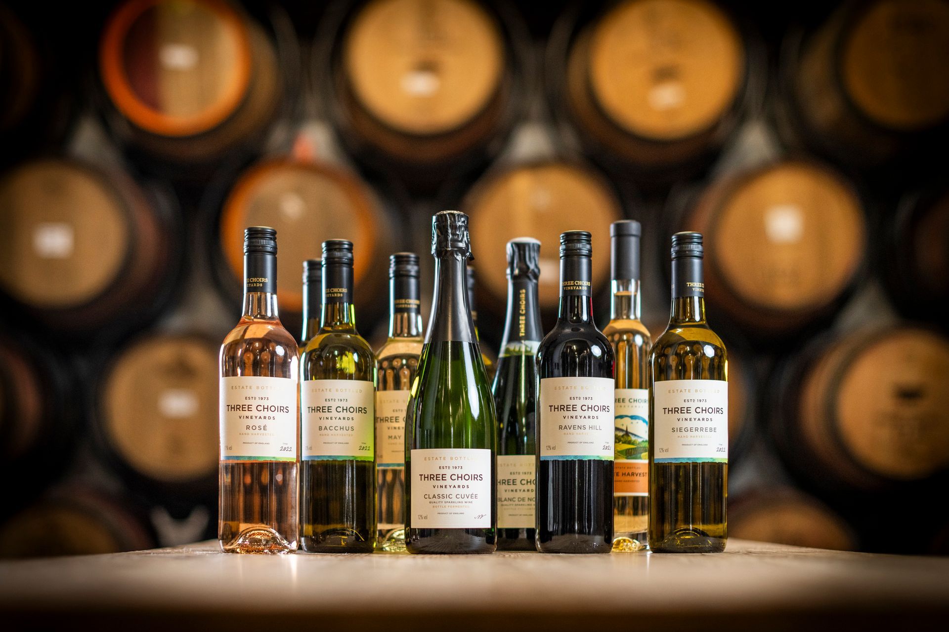 several bottles of wine are lined up on a table
