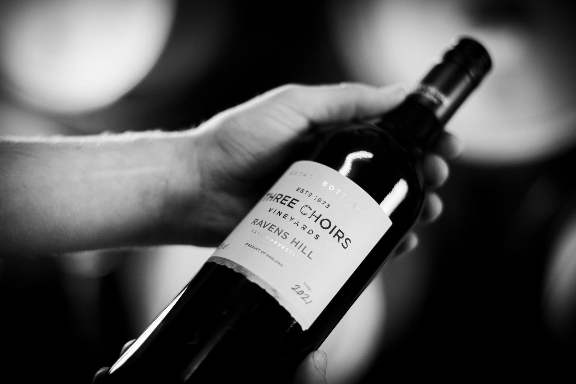 A bottle of wine labelled Three Choirs Vineyards Ravens Hill
