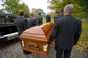Men Carrying Caskets