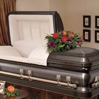 Metal Casket With Flowers on Top