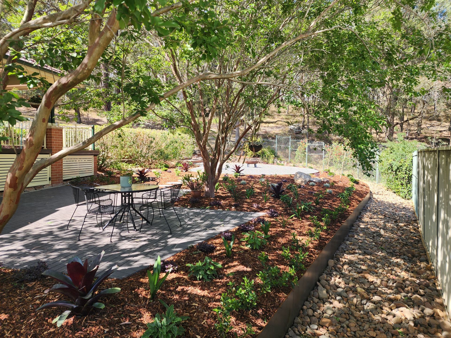 A stone path leading up to a set of stairs in a garden — Green Envy Landscape & Garden Services In Cameron Park NSW