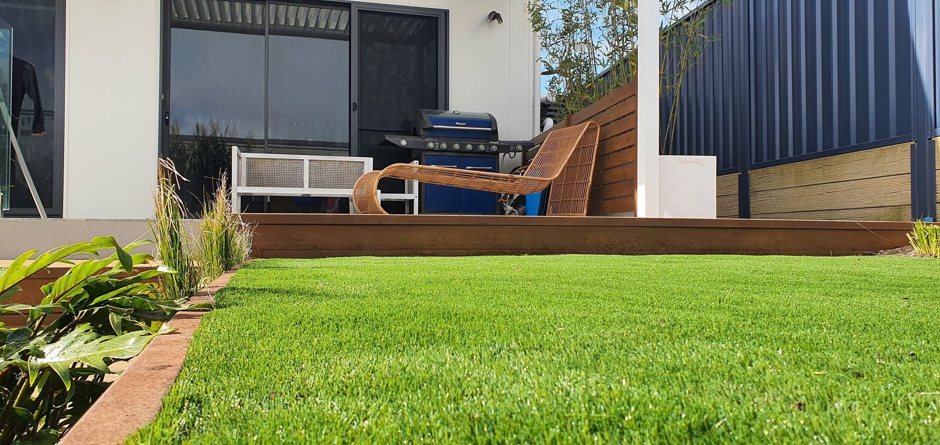A Large Lawn In Front Of A Building Under Construction — Green Envy Landscape & Garden Services In Cameron Park NSW