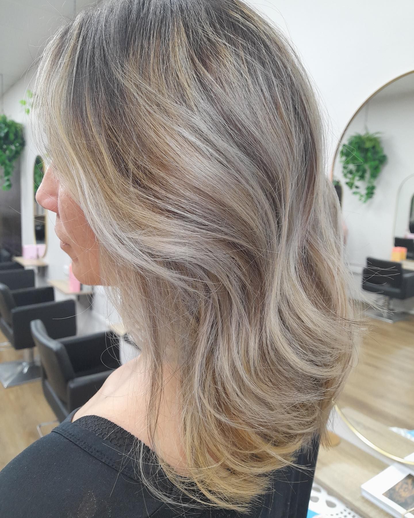 A Woman with blond highlights in her hair — AW Hair Studios - Surfers Paradise in Surfers Paradise, QLD