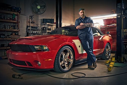 Mechanic Posing On Sports Car — Metairie, LA — Bert's Auto Repair Mechanic Posing On Sports Car — Metairie, LA — Bert's Auto Repair