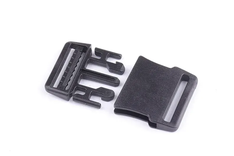 Black plastic side-release buckle, unfastened, with two interlocking parts.