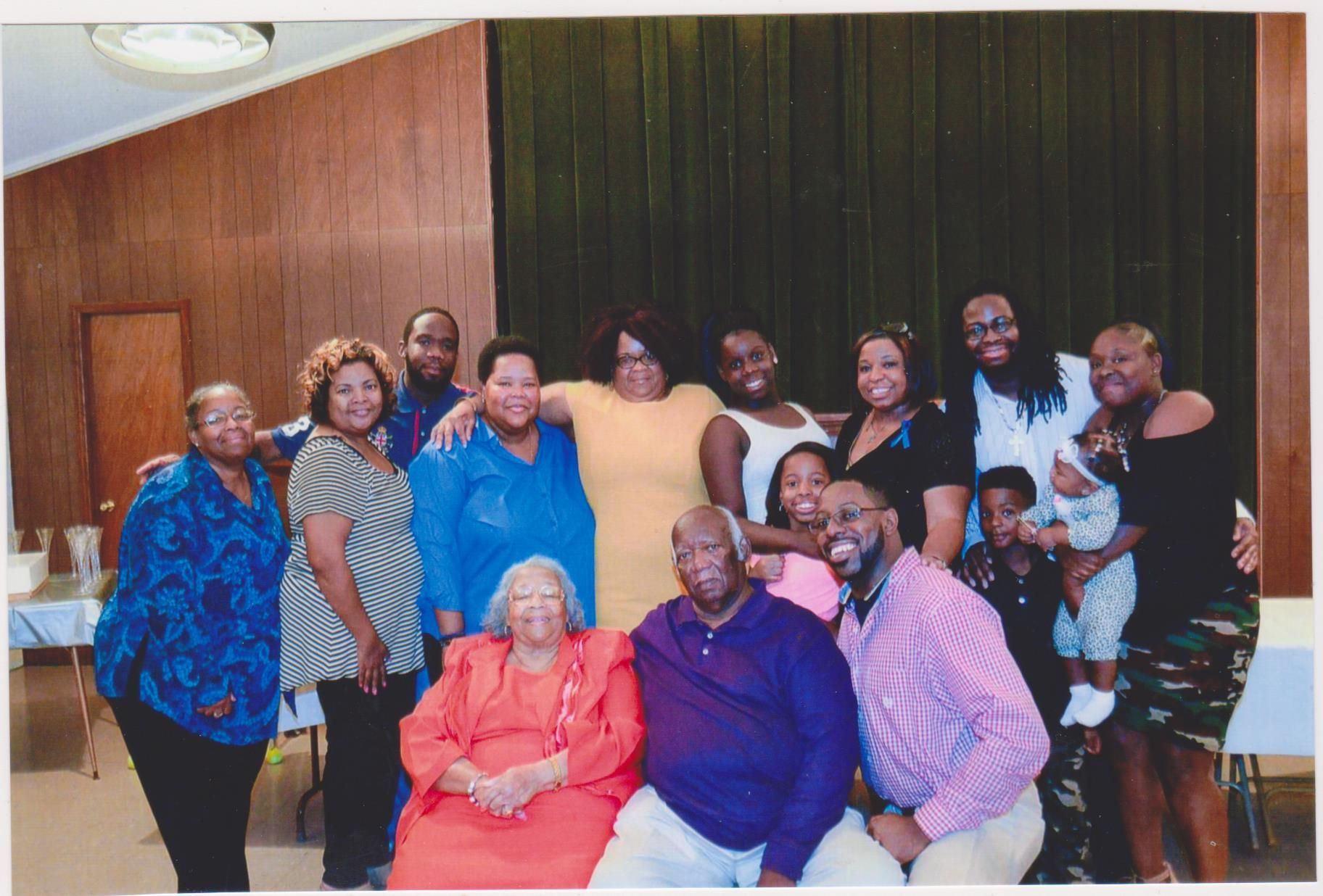 A group of people posing for a picture in a room