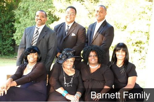 A group of people posing for a picture with the name barnett family on the bottom