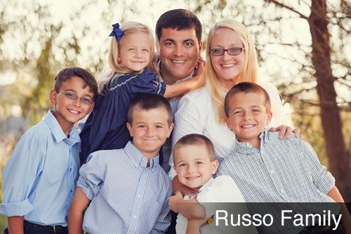 The russo family is posing for a picture together