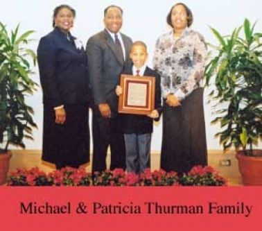A picture of the michael and patricia thurman family