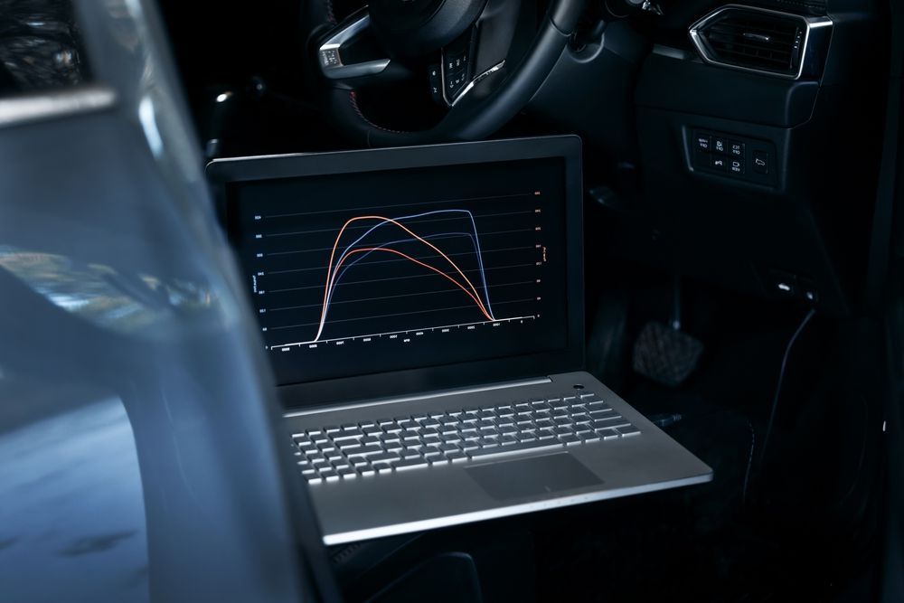 Laptop Inside a Car Displaying Engine Performance Graphs — Grease Monkeys Automotive N Performance in Hervey Bay, QLD