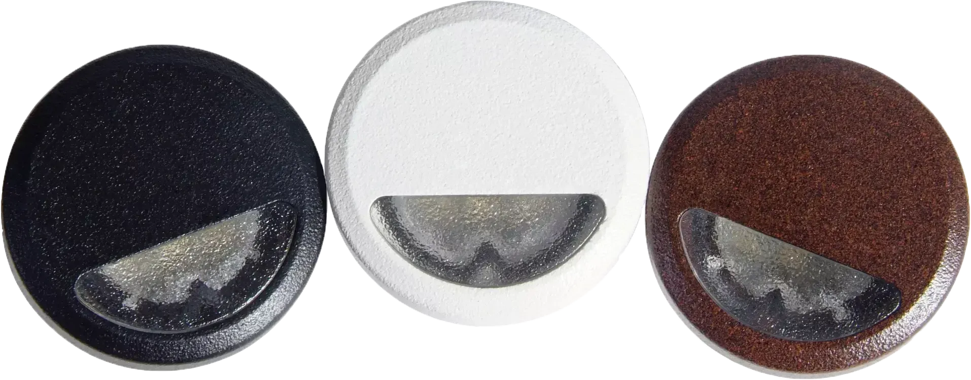 Three round, recessed lights in black, white, and bronze, each featuring a semi-circular, downward-facing frosted lens.