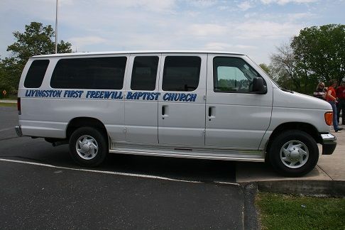 a white van that says livingston first freewill baptist church on the side