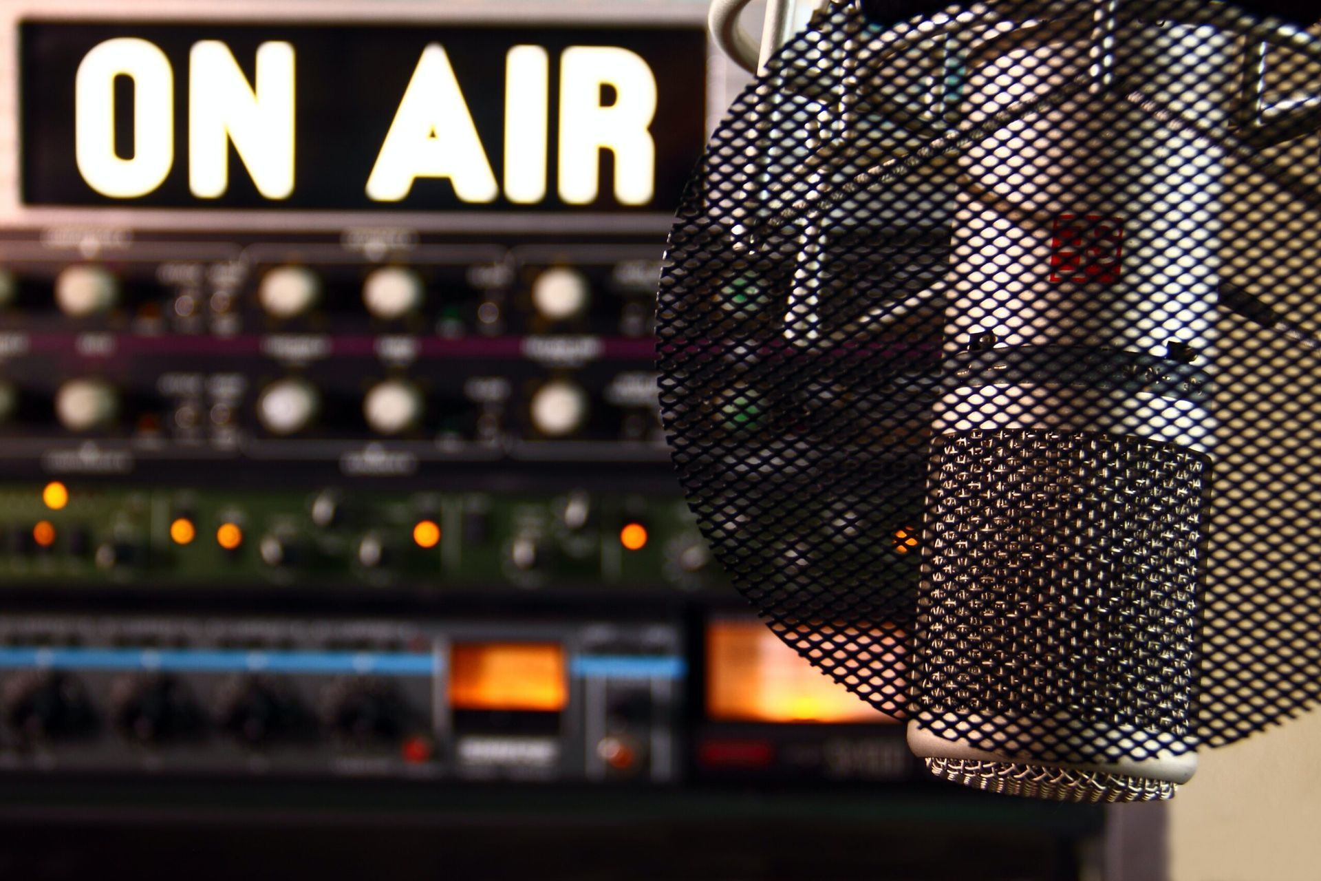 a microphone in front of a sign that says on air