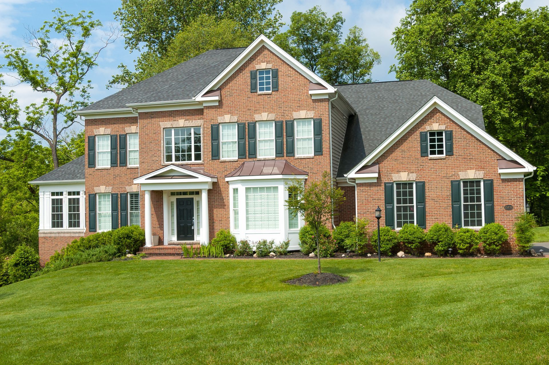 Landscaped backyard with stone patio
