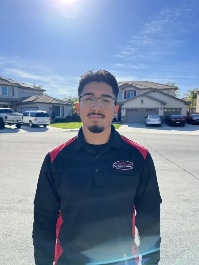 Michael Cervantes, owner and lead technician of Push N Pull Paintless Dent Repair, wearing his company uniform