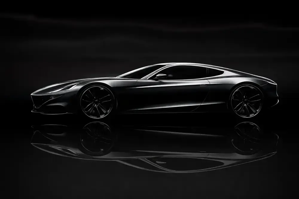 Sleek, black sports car reflected in a dark surface.