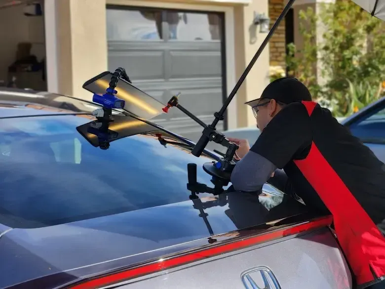Michael Cervantes performing mobile paintless dent repair on a vehicle using professional PDR tools