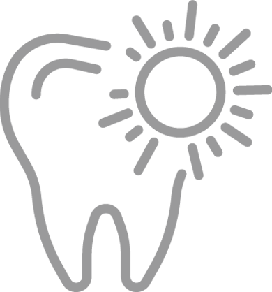 Dent saine illuminée par le soleil, symbolisant la santé dentaire ou un sourire éclatant.