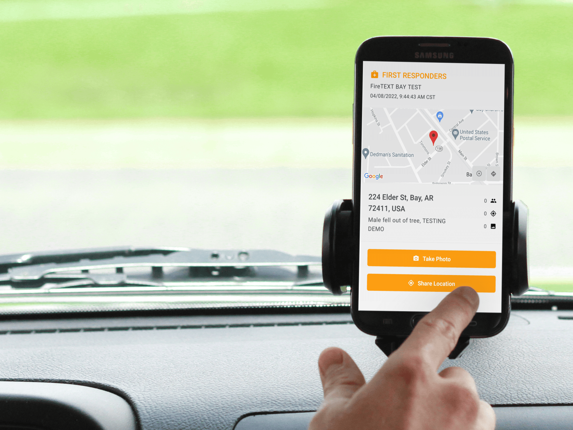 A person is using a cell phone in a car.
