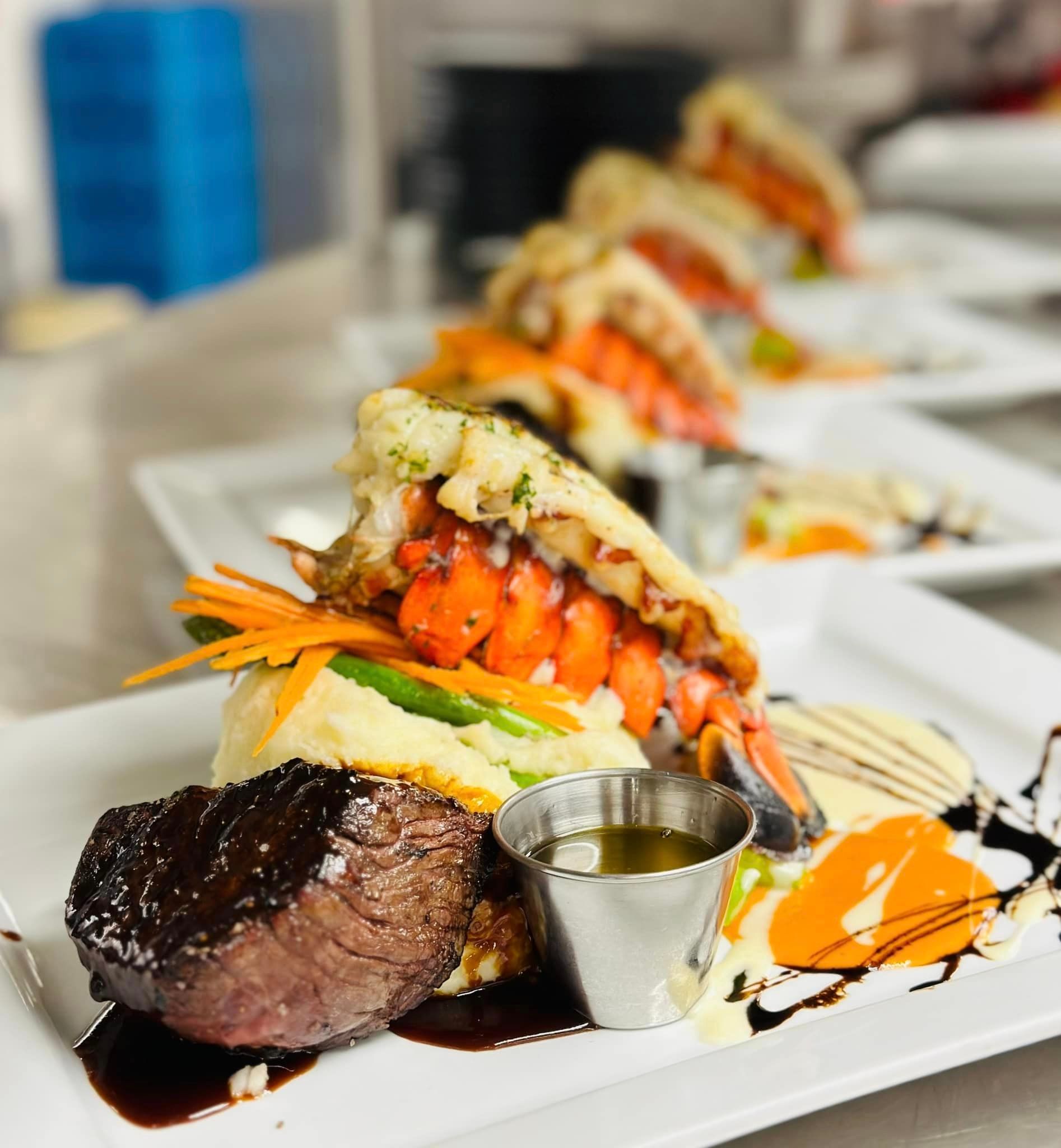 A close up of a plate of food with meat and vegetables on a table.