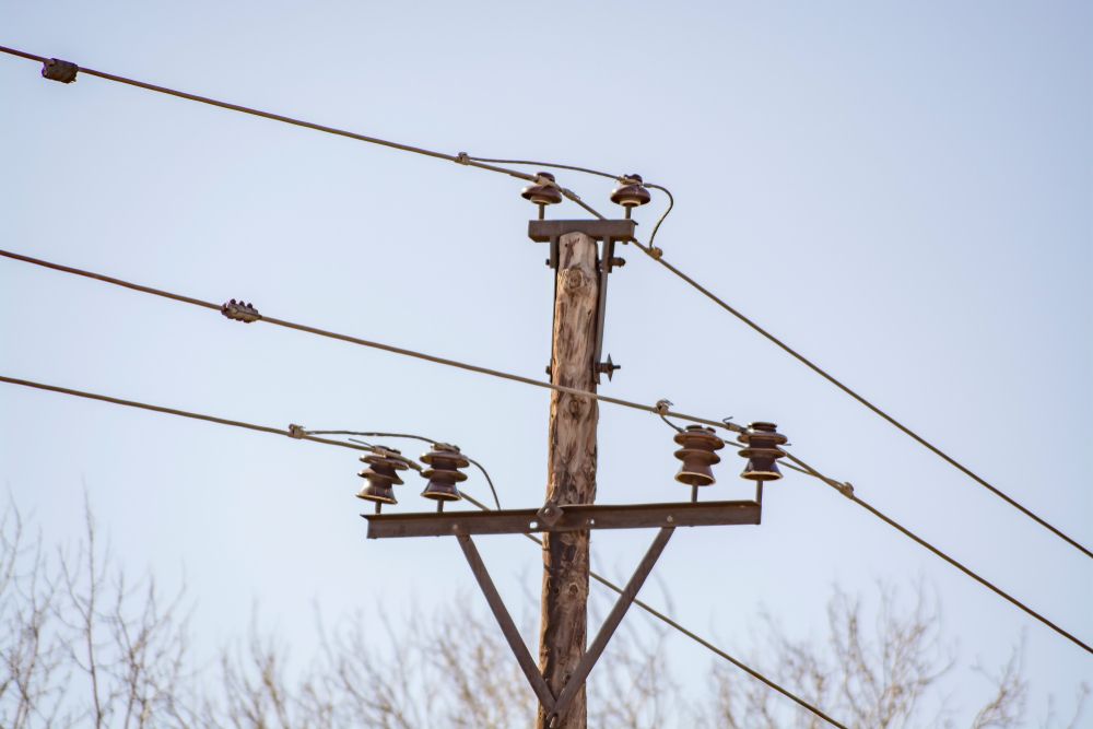 A Wooden Pole With A Bunch Of Wires Attached To It — Connect Mid Coast Electrical Services In Taree, NSW
