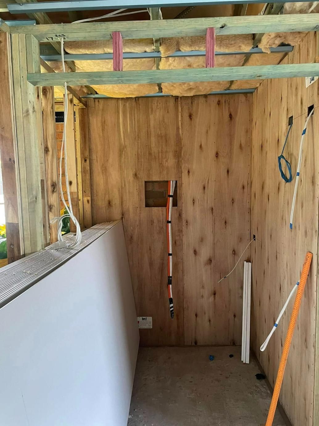 A Room With Wooden Walls And A Ladder Hanging From The Ceiling — Connect Mid Coast Electrical Services In Wingham, NSW